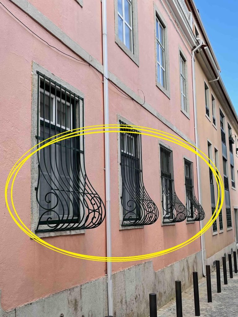 The Meaning Behind the Curved Bottom of Some Window Bars