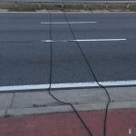 What Those Black Rubber Cables on the Road Really Do