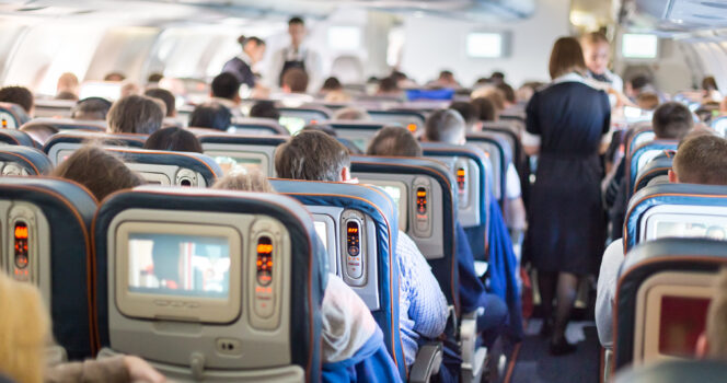 Father Holding Daughter’s Head on Plane Draws Praise and Criticism