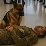 A Soldier’s Best Friend Stands Guard in a Busy Airport