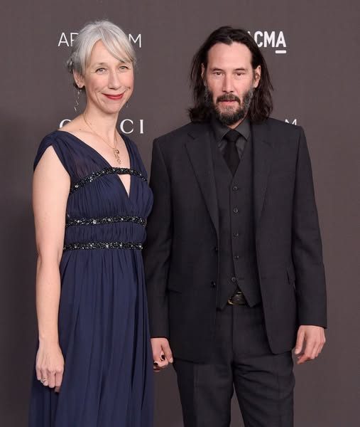Keanu Reeves’ girlfriend, 54, faces mixed reactions after posing in teal cut-out dress on red carpet