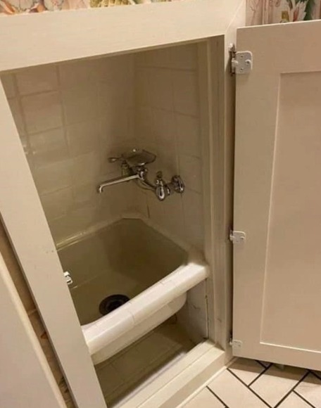 The Little Porcelain Bathtub for Brooms